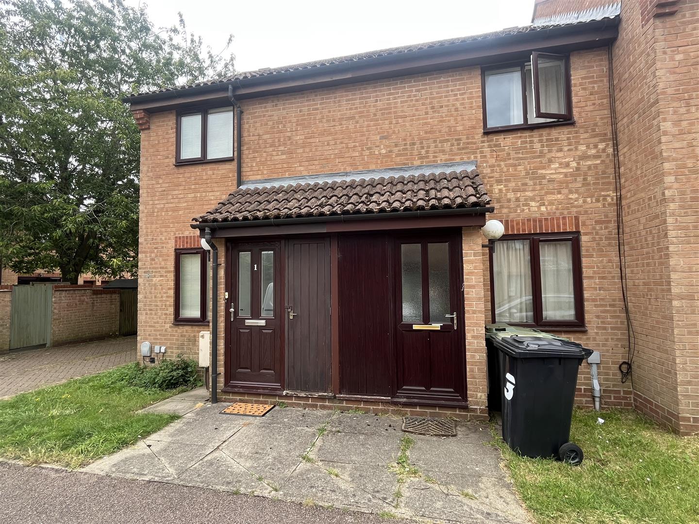 Brick semi-detached house with twin front doors